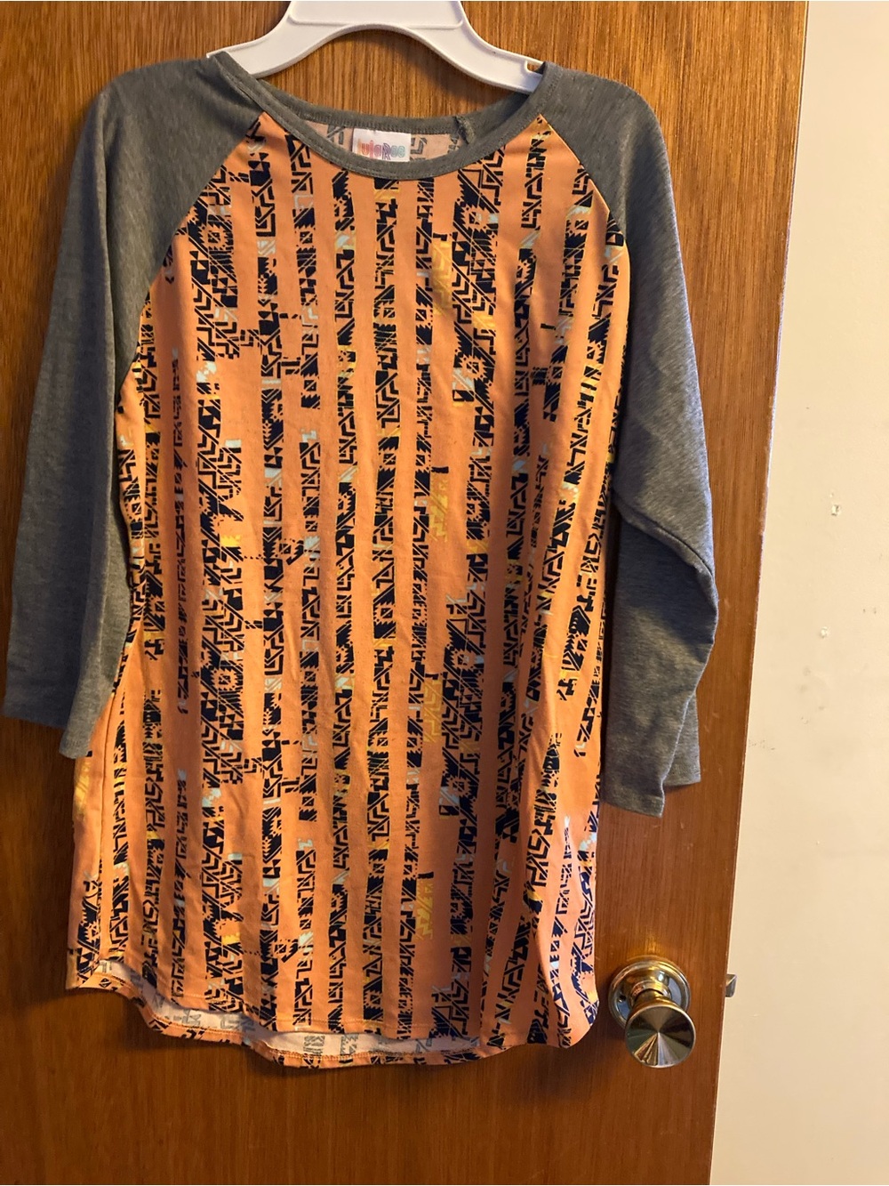 LuLaRoe Peach and Gray Long Sleeve Raglan Top with Navy Geometric Stripes